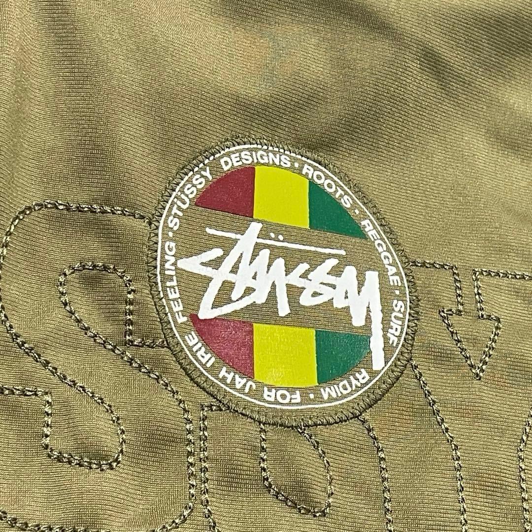 ステューシー トラックジャケット ラスタカラー 刺繍ロゴ ジャージ カーキ系 M