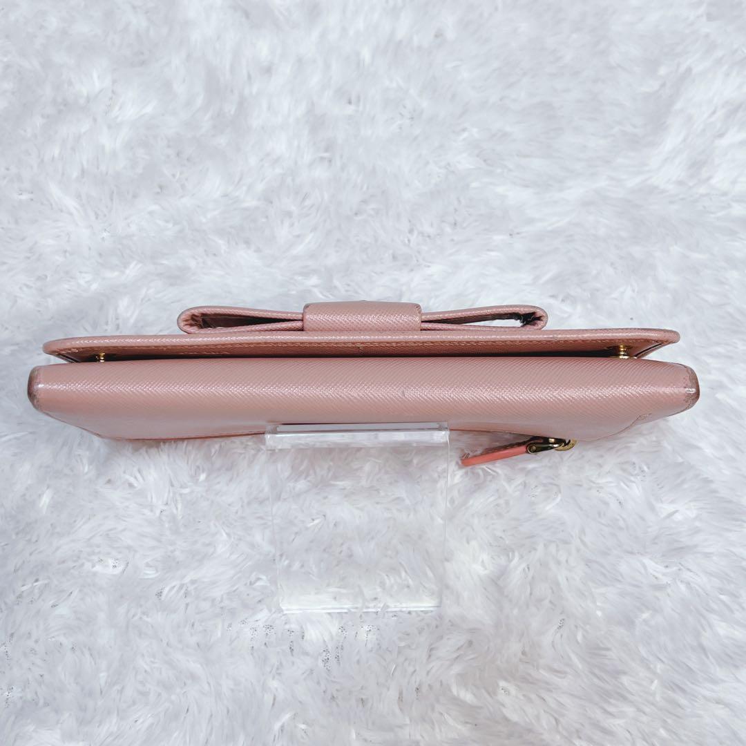 PRADA プラダ　長財布　サフィアーノ　フィオッコ　メタルロゴ　ピンク　リボン