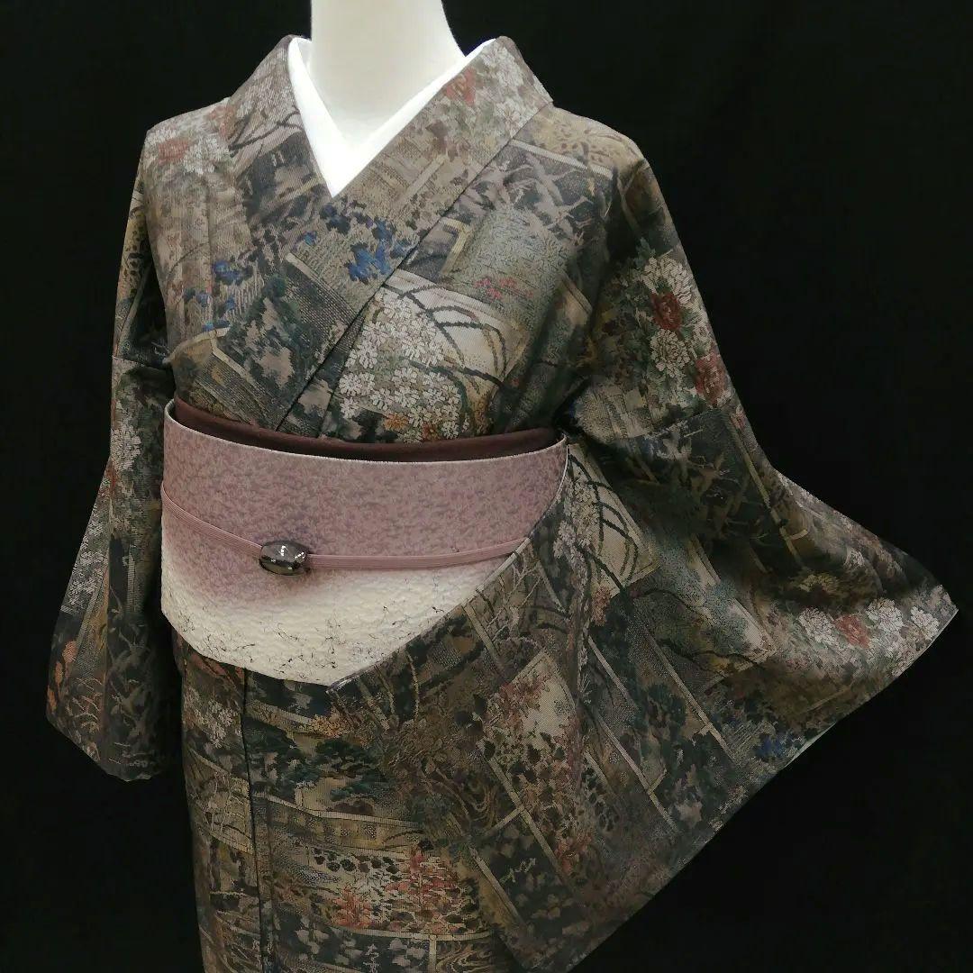 本場大島紬(袷)　(四季の草花紋様　恵 積五郎(絣の魔術師)　裄68㌢身幅広め)