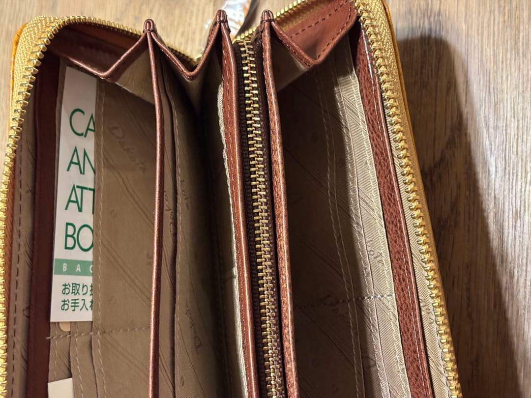 新品 未使用 ダコタ 長財布 ラウンドファスナー オスピタリタ マスタード 黄色