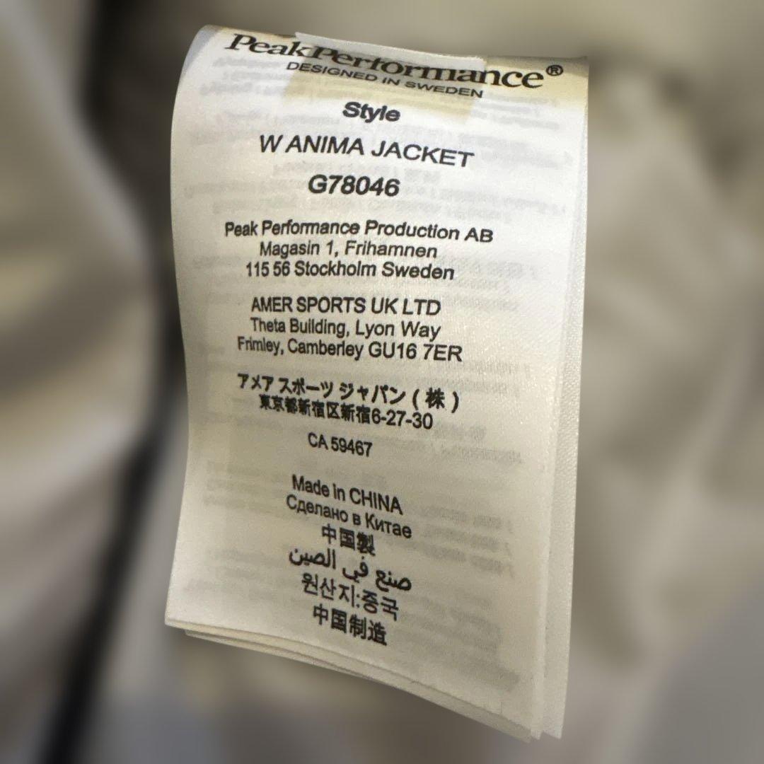 美品Peak Performance 薄ピンクフード付きスキーウェア