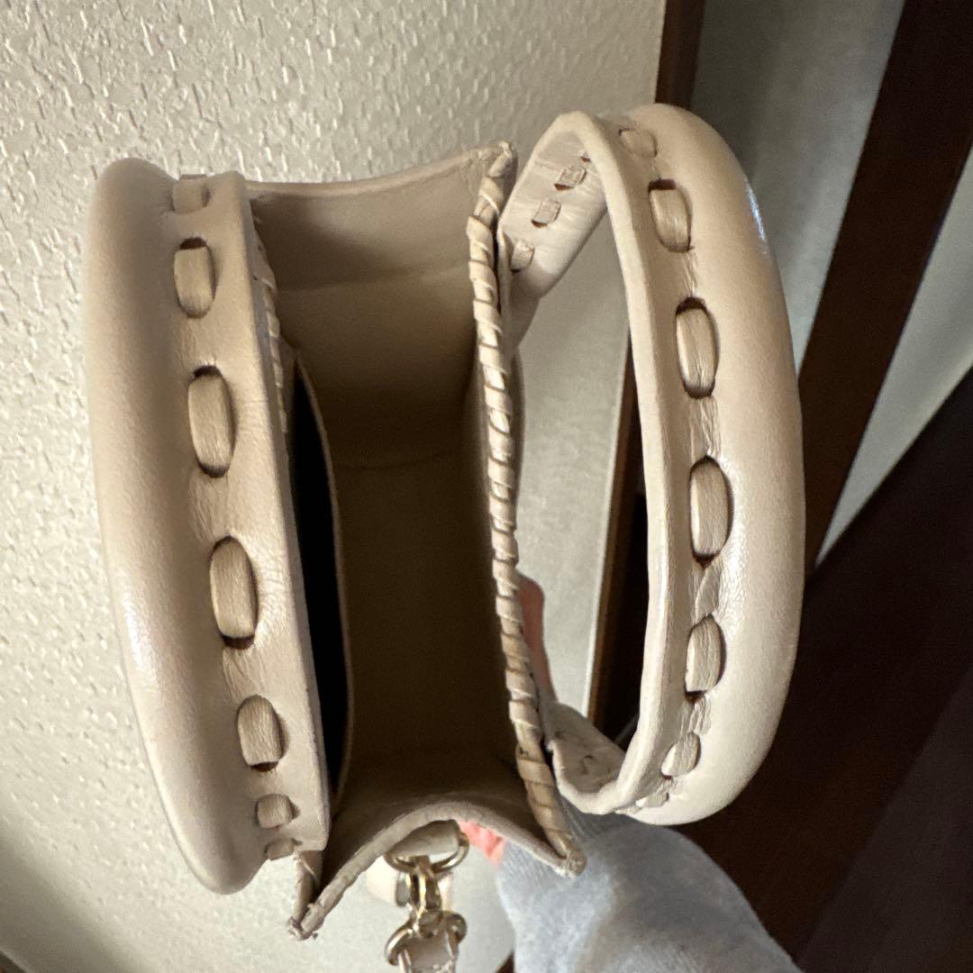 Carving Tribes エンボス花柄ショルダーバッグ