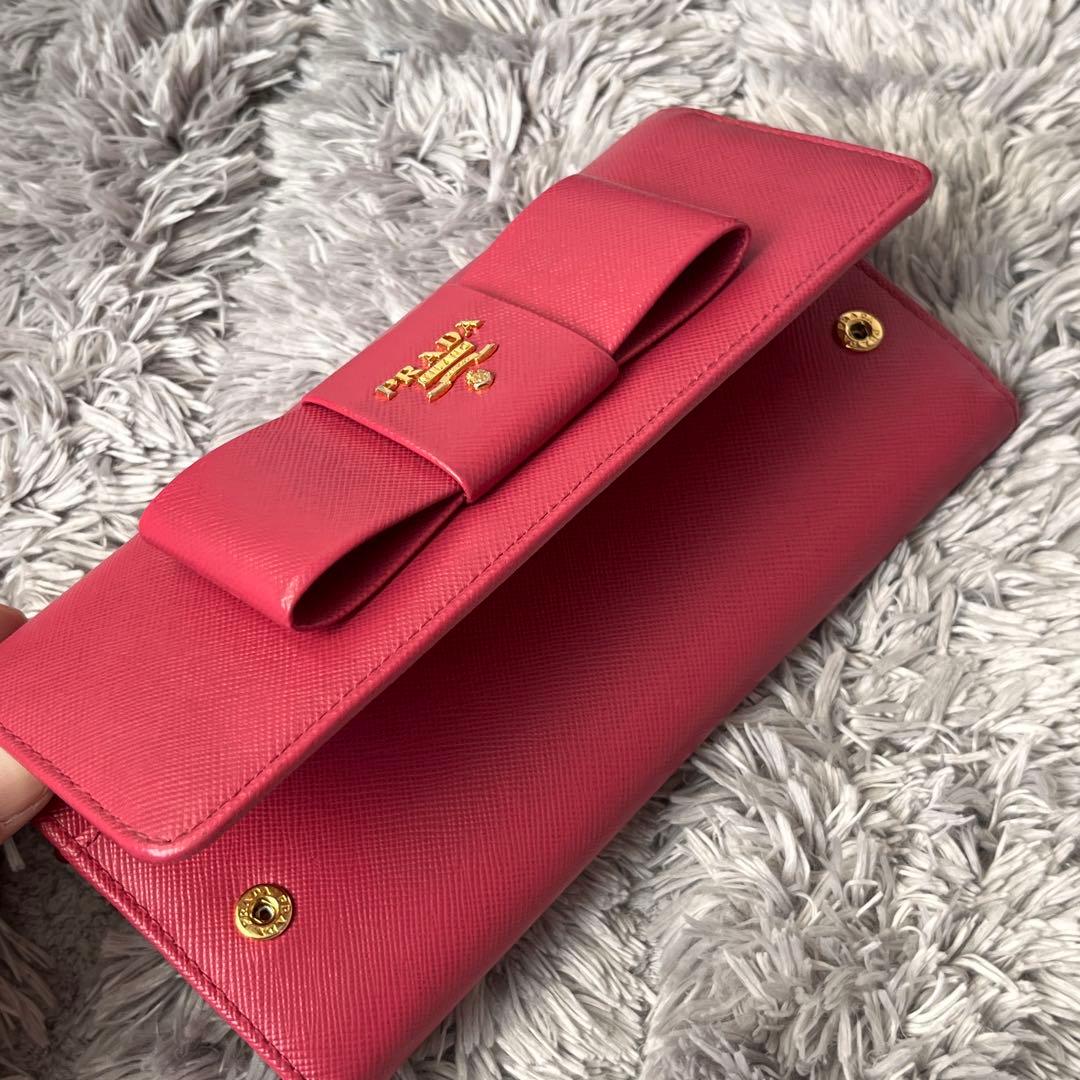 良品✨PRADA フィオッコ　サフィアーノ　メタルロゴ　リボン　ピンク　長財布